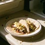 Delicious breakfast tacos served with fresh ingredients and vibrant toppings.