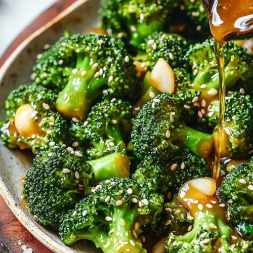 Delicious broccoli stir-fry with garlic sauce served in a bowl.