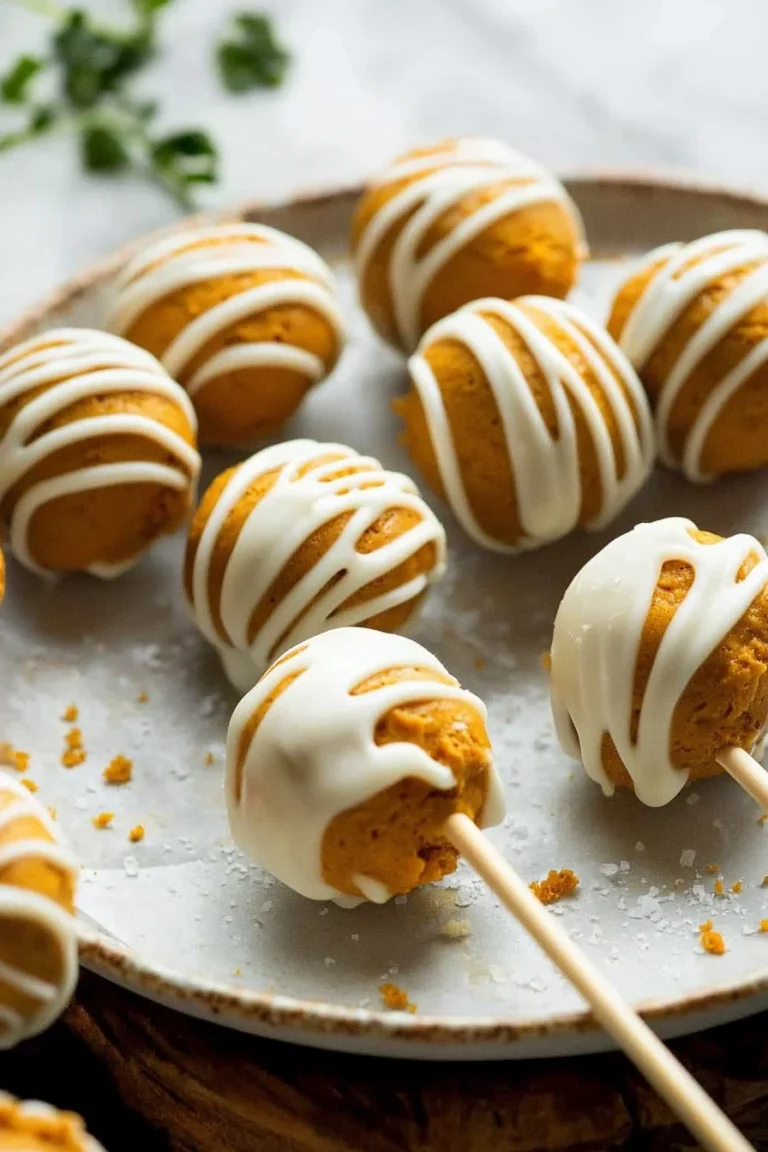 Deliciously decorated Pumpkin Cake Pops on a festive platter for autumn celebrations