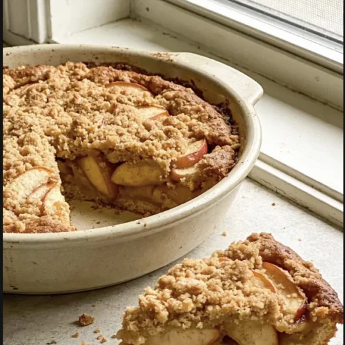 Delicious homemade Apple Crumb Cake with apple slices and crumb topping