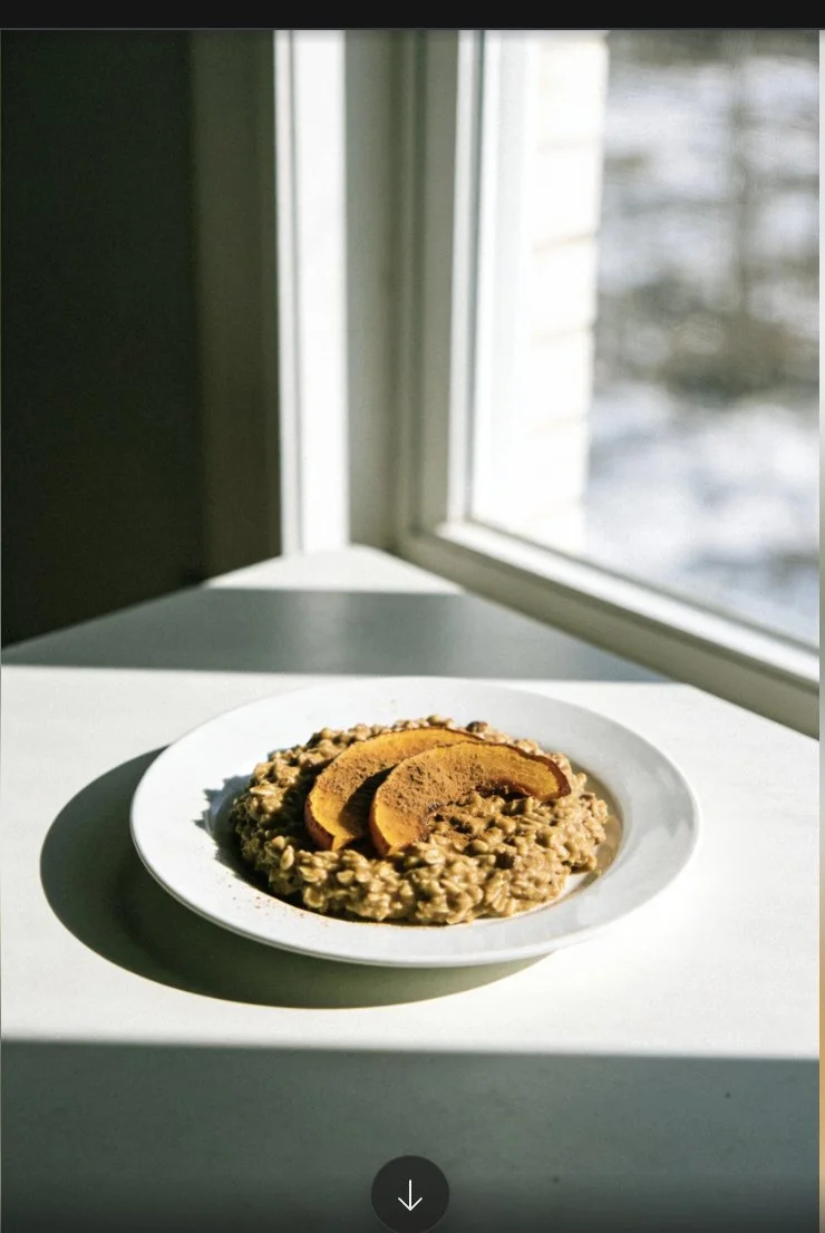 Delicious pumpkin spice baked oats in a bowl, topped with nuts and cinnamon.